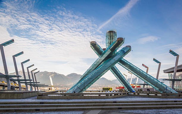Portrait at Jack Poole Plaza with Olympic Cauldron and harbour.