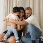 family hugging studio portrait