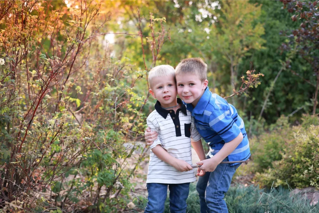brothers hugging fall portrait