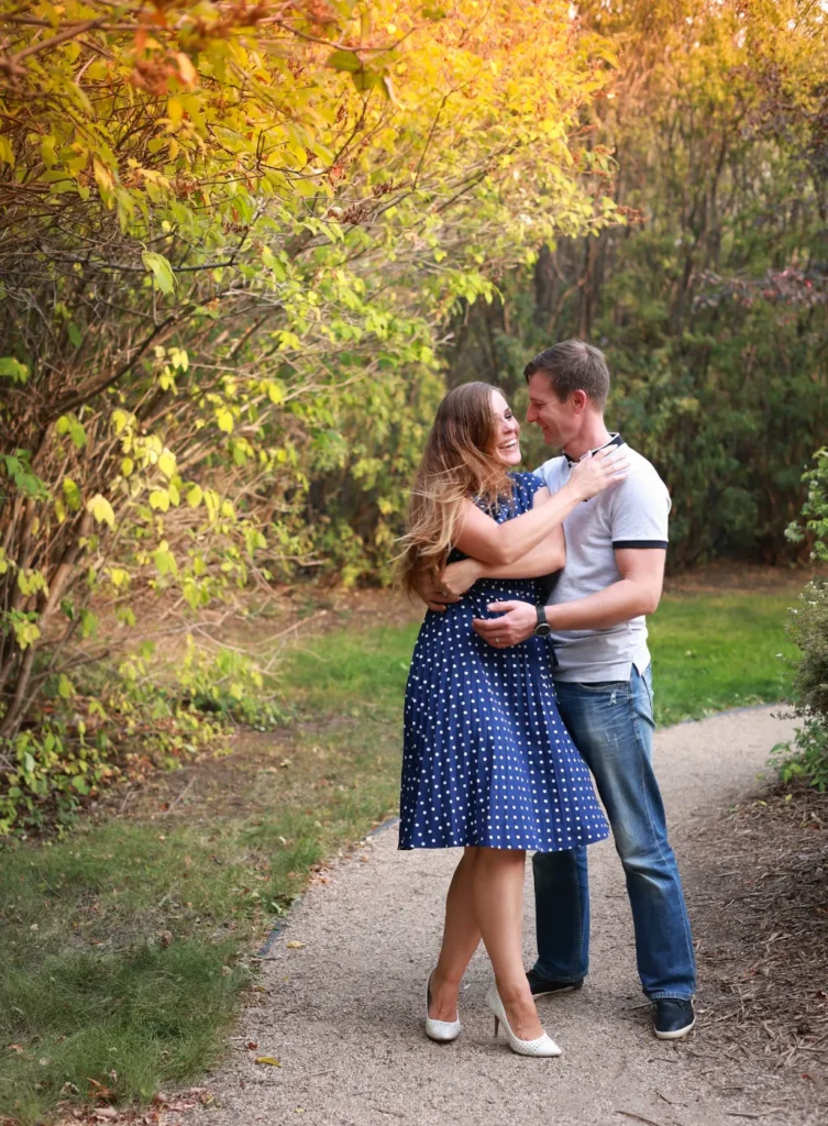 couple walking fall trail