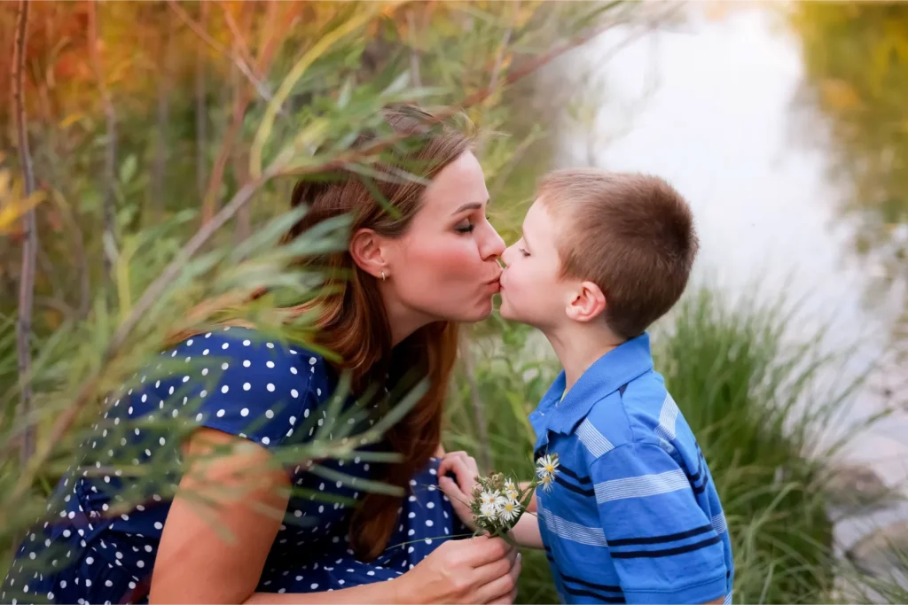 mother kissing son fall session