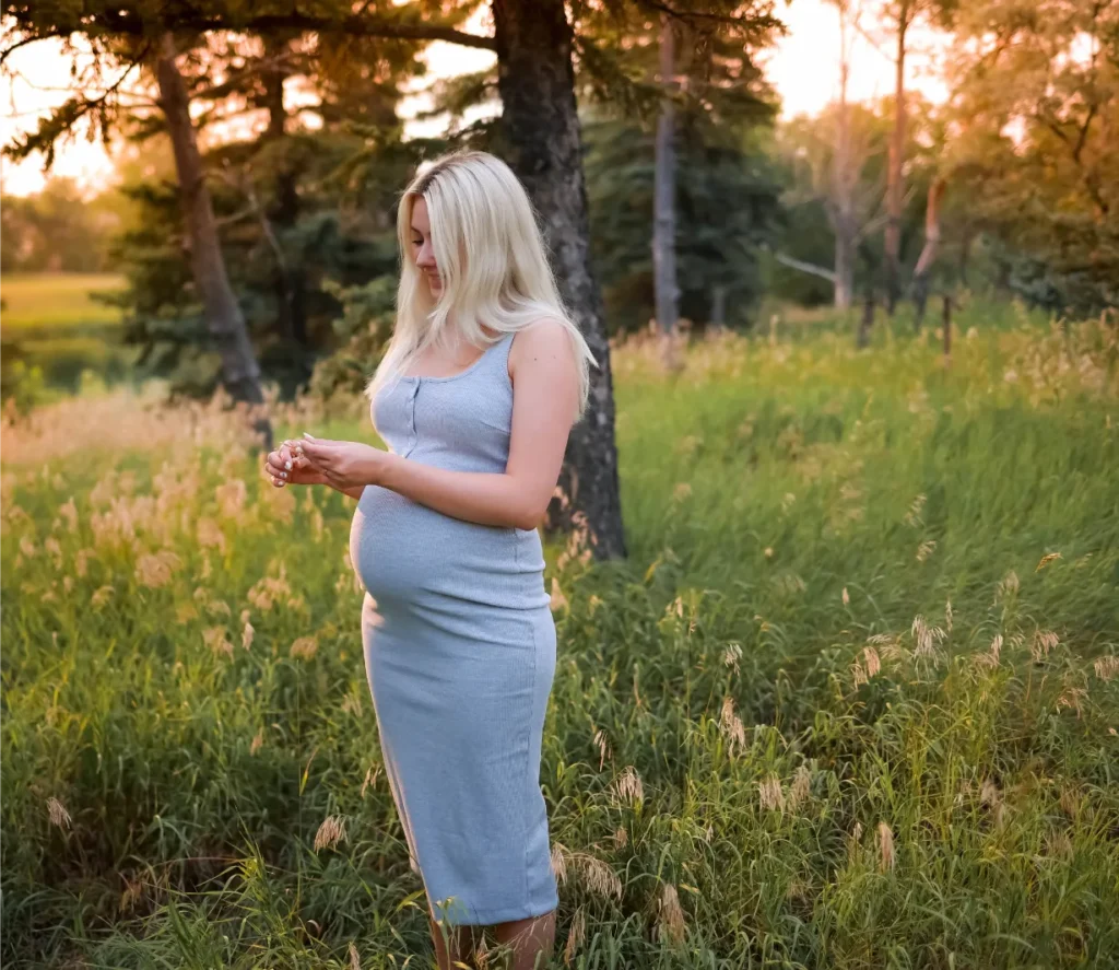 pregnant woman golden field portrait