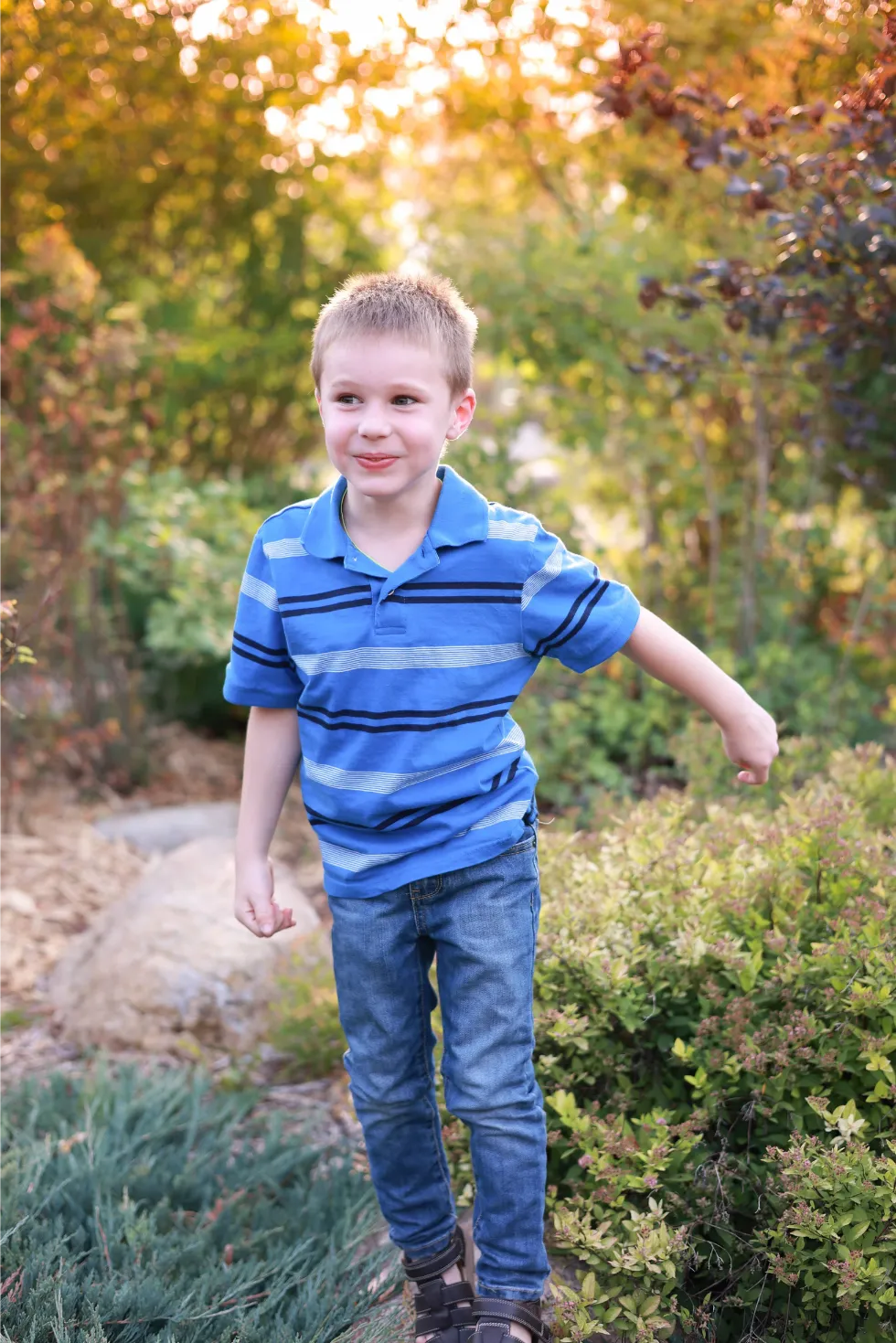 young boy running fall session