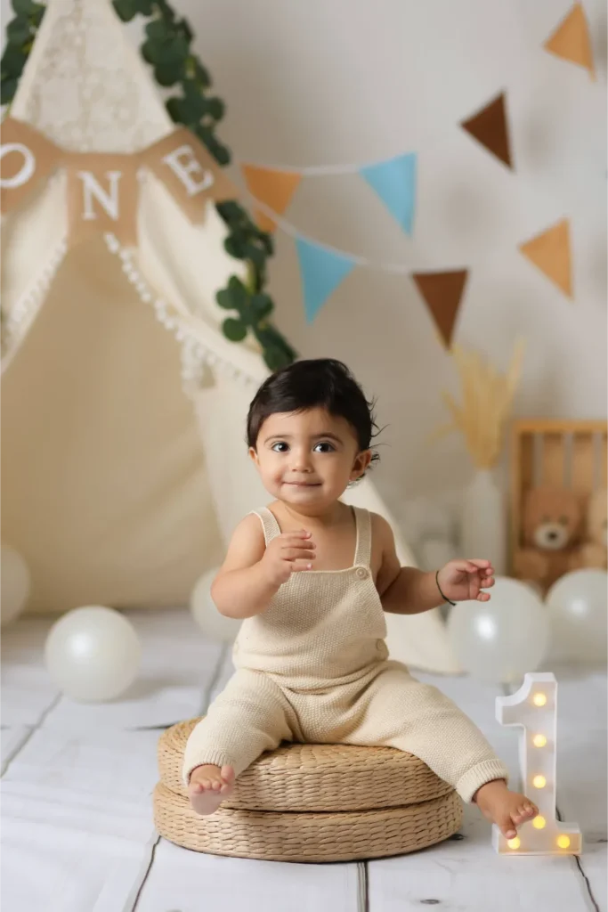 baby boy one year portrait rattan chair