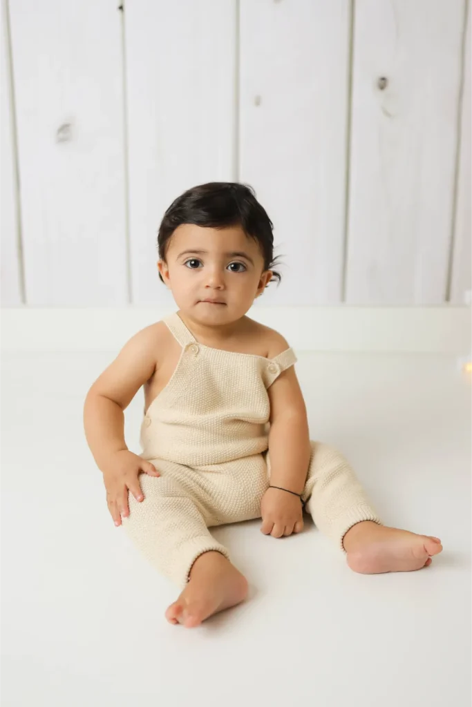 baby boy sitting neutral studio portrait