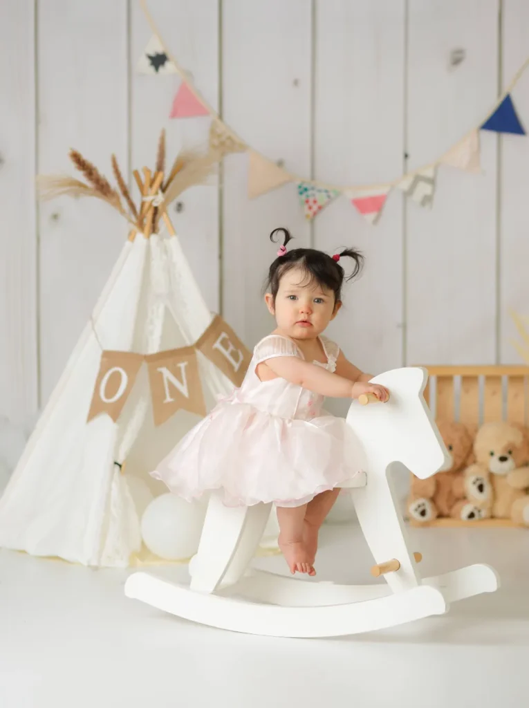 baby girl pink dress rocking horse