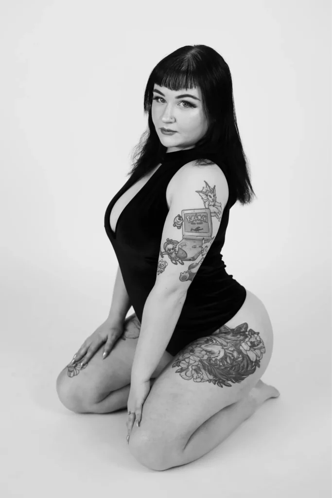 boudoir black dress seated bw