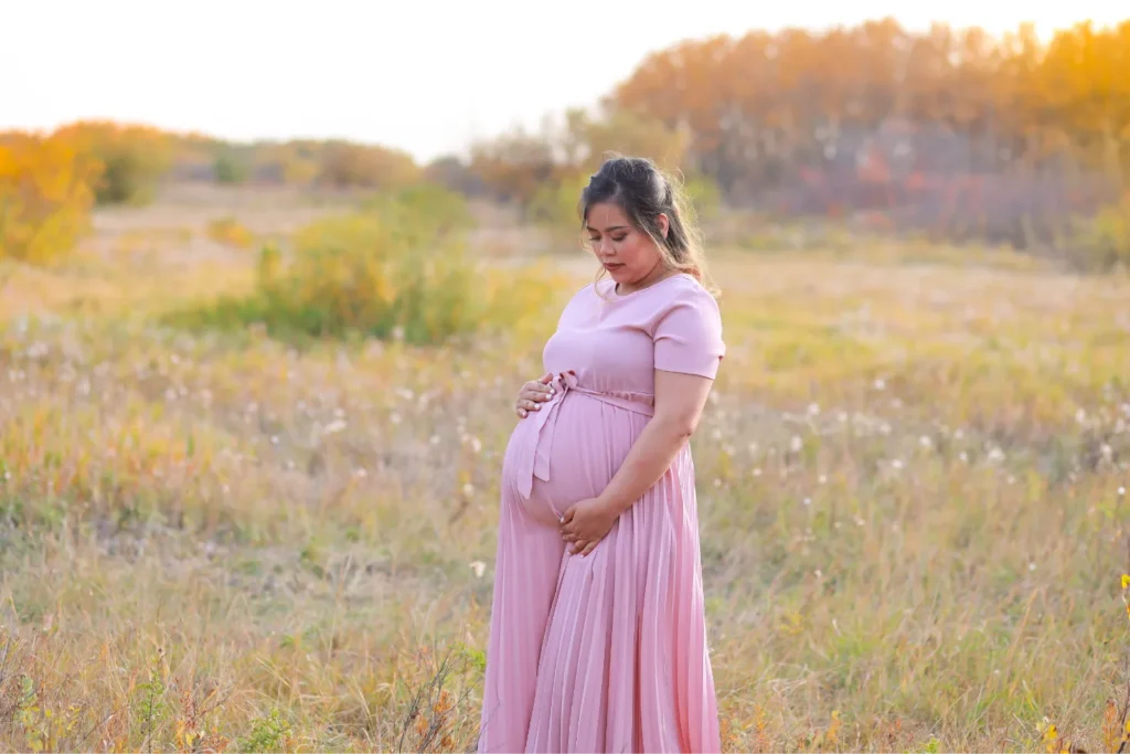 pregnant woman field sunset