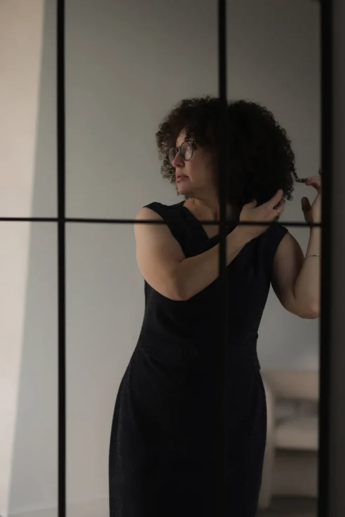 woman black dress window portrait