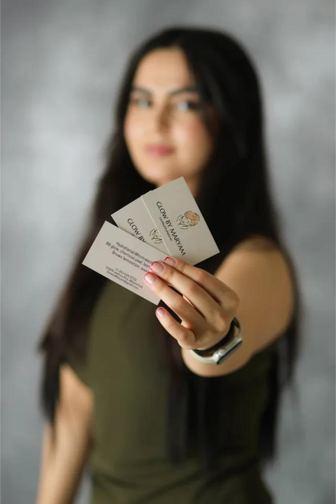 woman holding business cards branding portrait