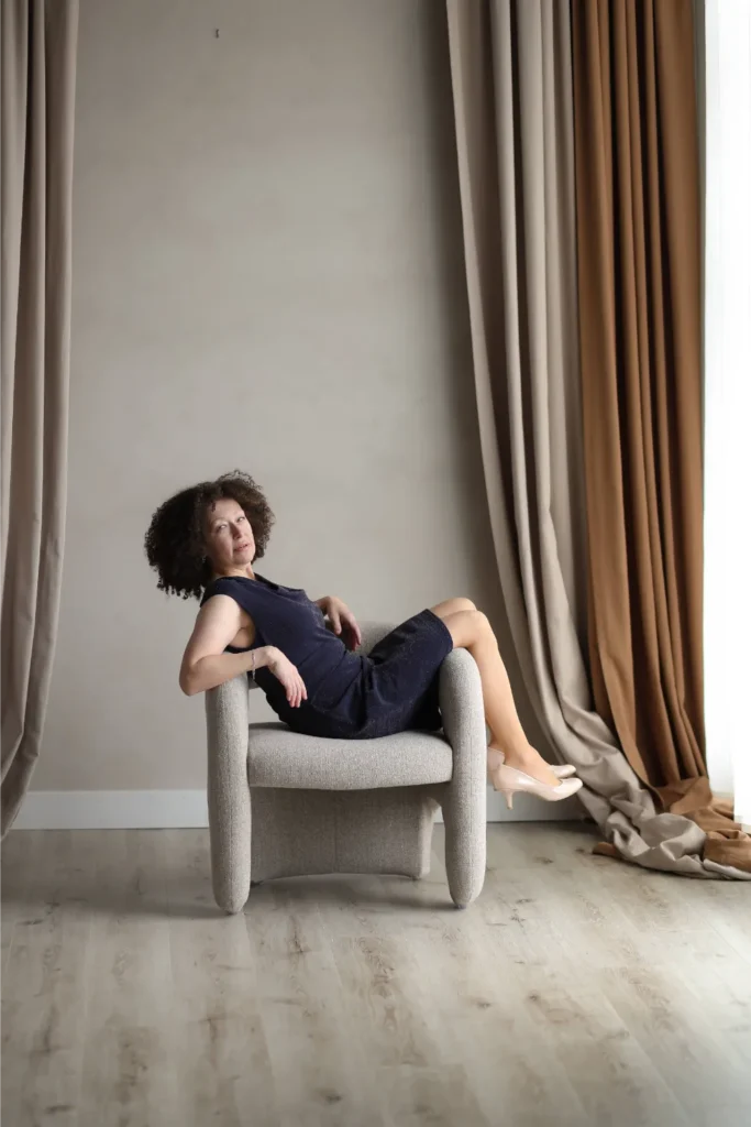 woman sitting chair studio portrait