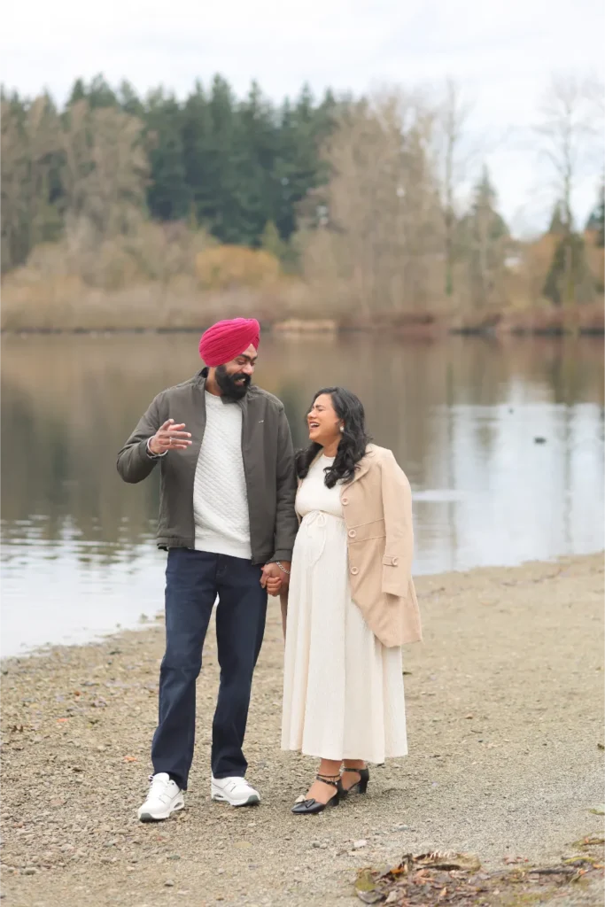 couple standing by lake portrait
