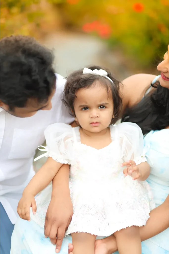 parents with baby girl outdoor session