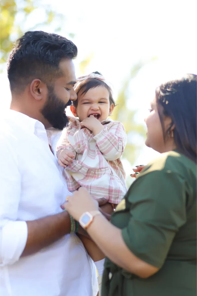 parents with toddler outdoor portrait