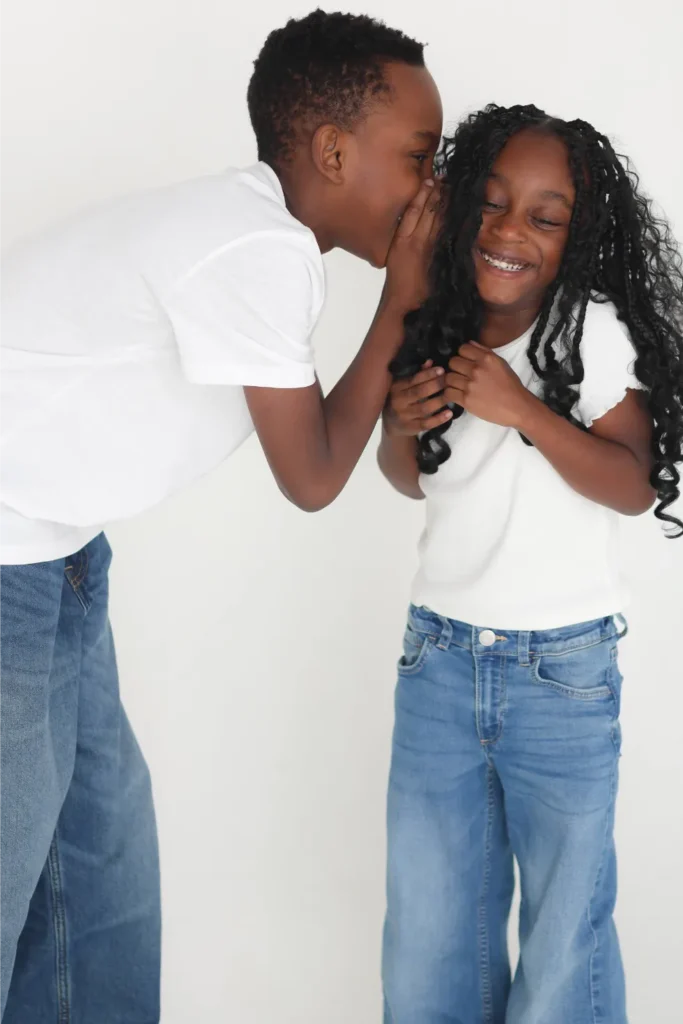 siblings playing during studio family session