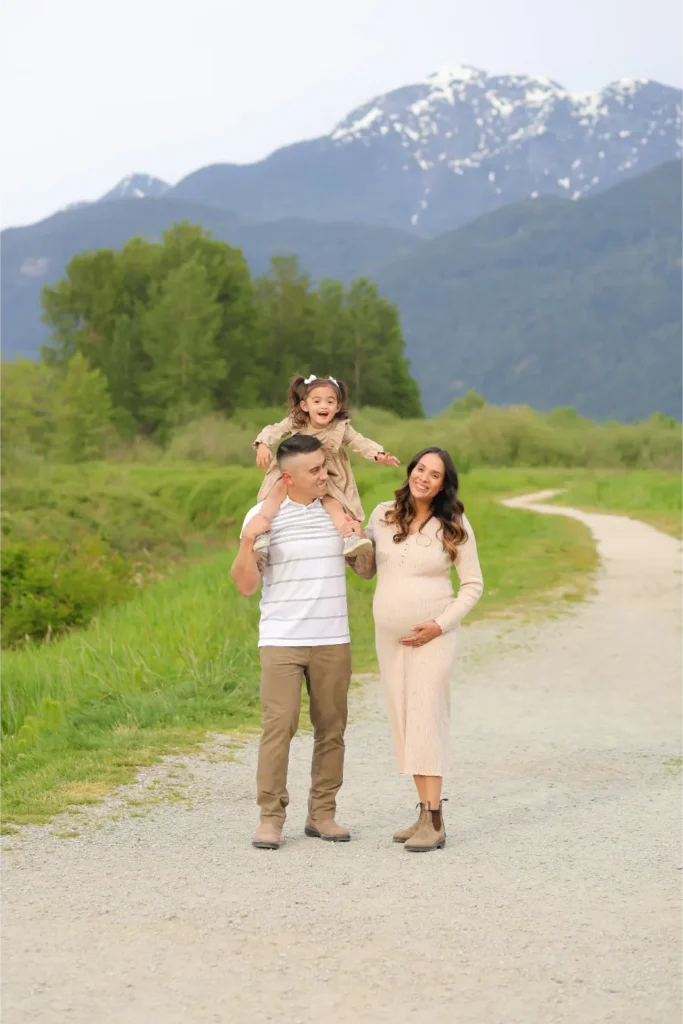 family walking mountain path sunset