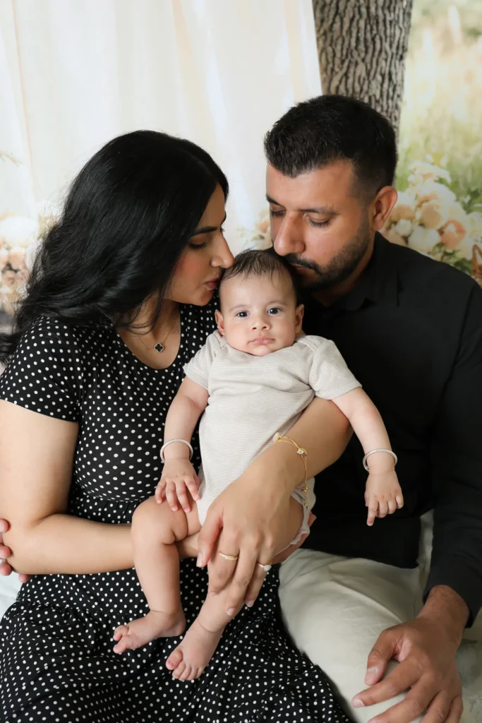 family portrait baby kiss