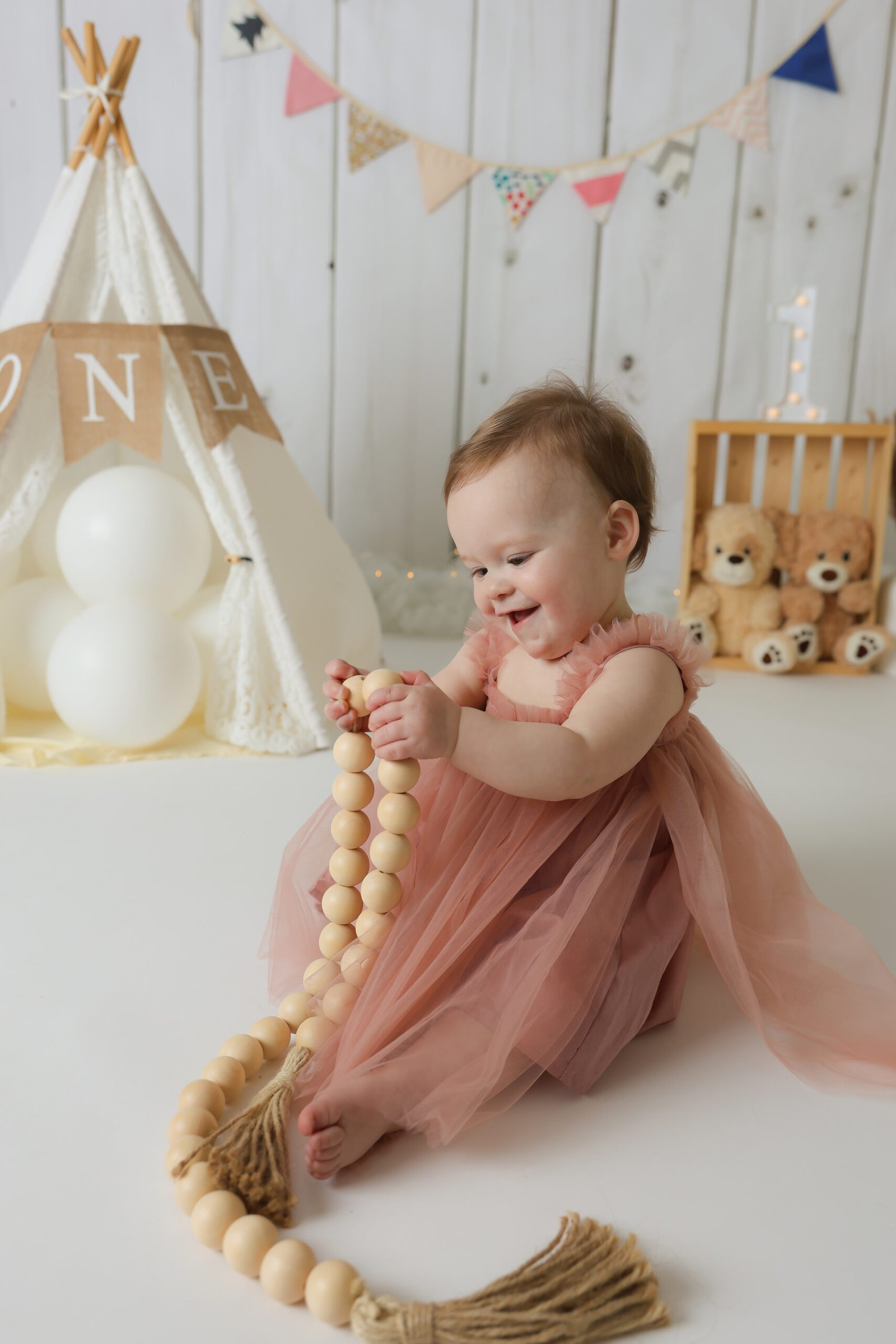 Baby Girl Holding Boho Beads, photo 5
