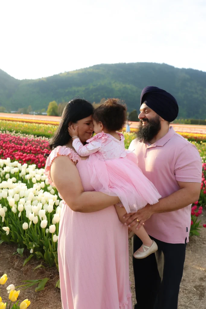 family maternity session tulip field embrace