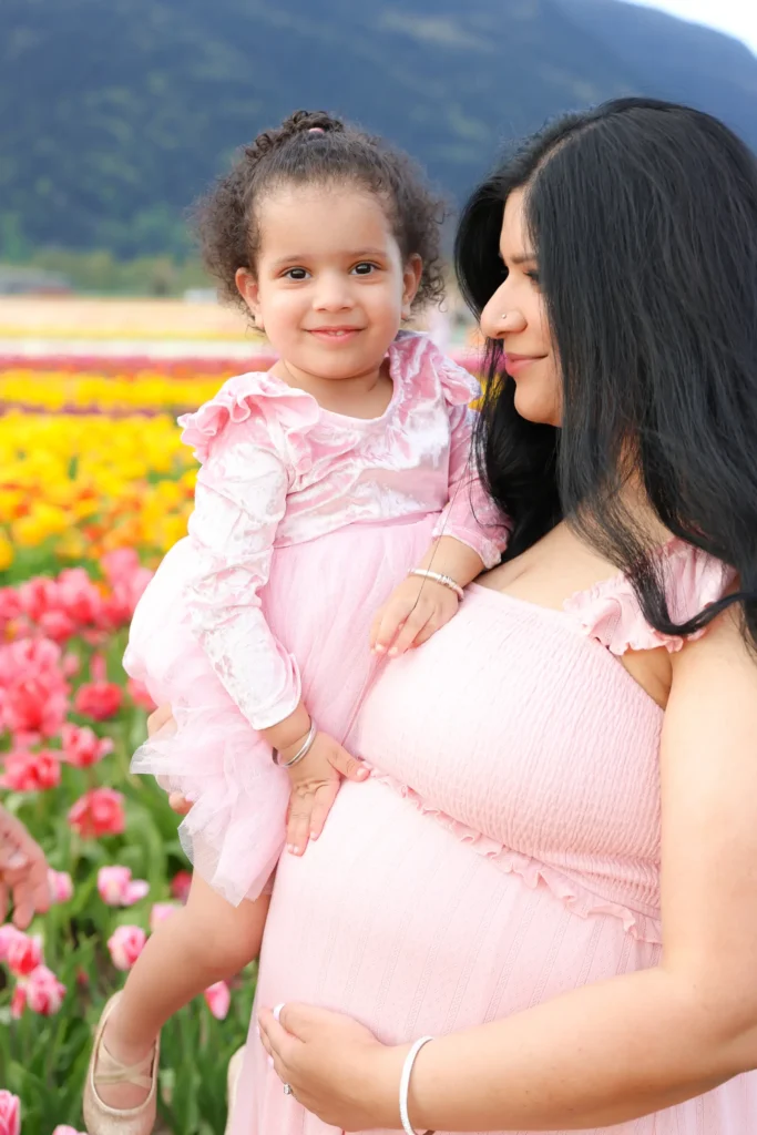 mother holding daughter maternity portrait