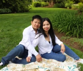 Couple sitting on blanket smiling during outdoor portrait Couple sitting on blanket smiling during outdoor portrait