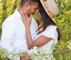 Couple standing close together outdoors sharing quiet moment Couple standing close together outdoors sharing quiet moment