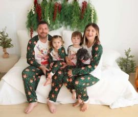 Family sitting by cozy armchairs with small Christmas trees scaled 1 Family sitting by cozy armchairs with small Christmas trees scaled 1