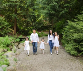 Family walking together along forest path Family walking together along forest path