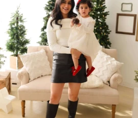 Mom lifting baby near Christmas tree indoor scene scaled 1 Mom lifting baby near Christmas tree indoor scene scaled 1