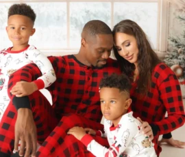 Parents and Child in Matching Christmas Pajamas Parents and Child in Matching Christmas Pajamas
