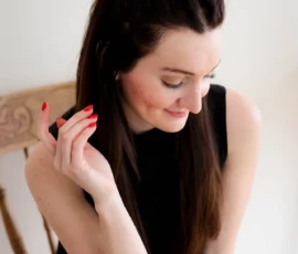 Woman looking down during relaxed indoor portrait