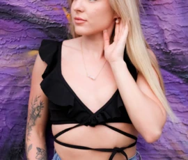 Woman posing against textured wall during creative portrait