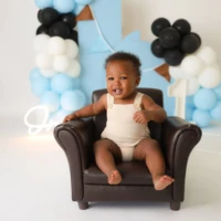 baby boy cake smash black chair scaled 1 baby boy cake smash black chair scaled 1