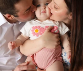 family snuggle with baby girl scaled 1 family snuggle with baby girl scaled 1