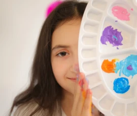 girl painting with color palette scaled 1