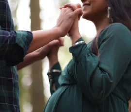 maternity couple hand hold green dress scaled 1 maternity couple hand hold green dress scaled 1
