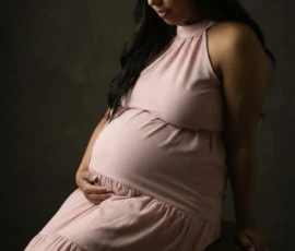 maternity portrait seated studio light maternity portrait seated studio light