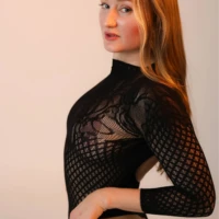 boudoir black bodysuit side seated boudoir black bodysuit side seated