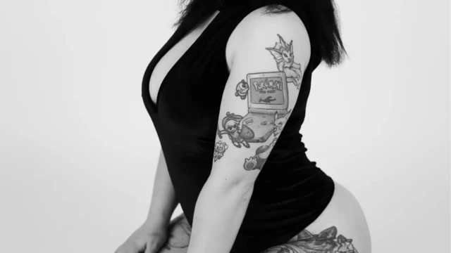 boudoir black dress seated bw